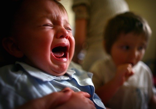 GLASGOW, UNITED KINGDOM - SEPTEMBER 03: A young boy reacts to receiving a immunization jab at a health centre in Glasgow September 3, 2007 in Glasgow, Scotland. Medical experts still believe the MMR jab is safe and that the vaccine does not cause autism. (Photo by Jeff J Mitchell/Getty Images)